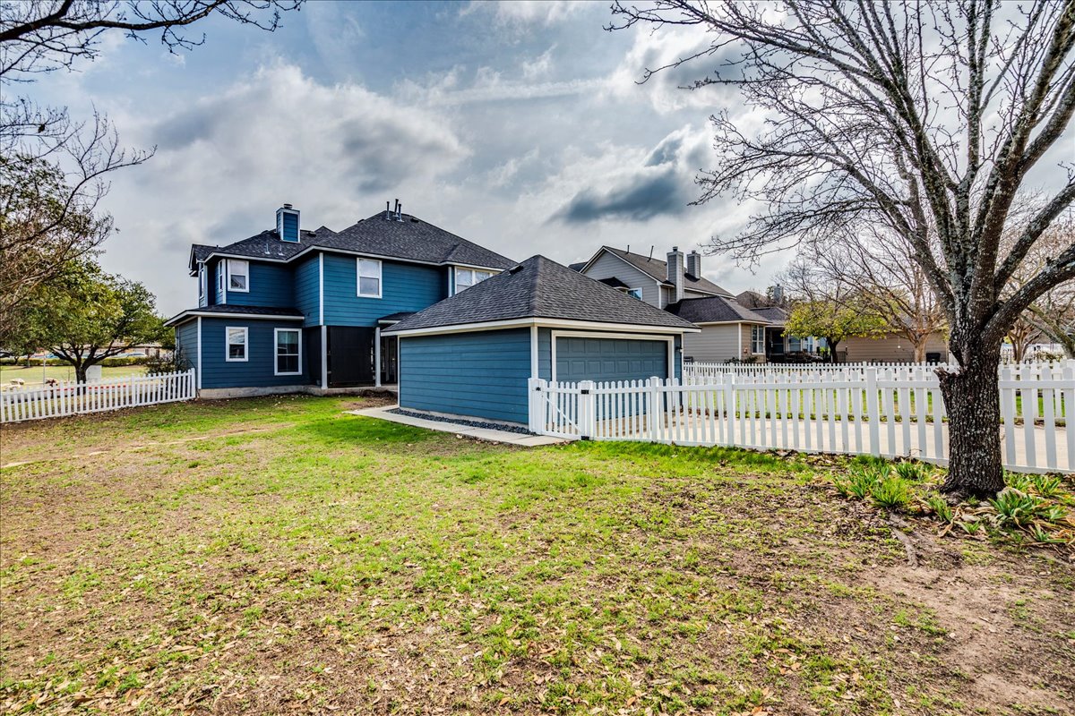 1077 Fairway Kyle, TX 78640 - Photo 39 of 40 a front view of a house with a yard