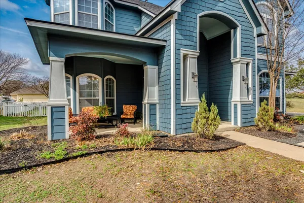 a front view of a house with garden
