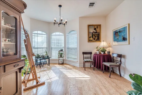 a view of a livingroom with furniture window and wooden floor
