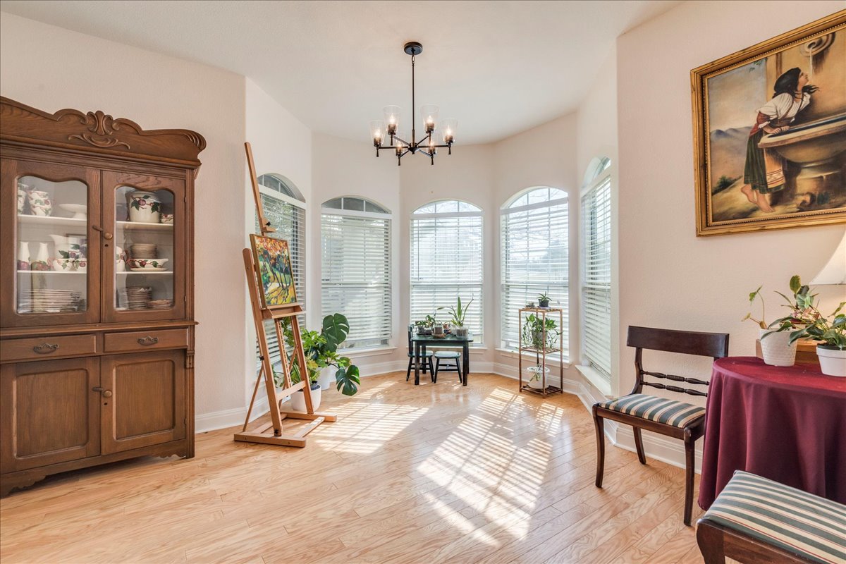 1077 Fairway Kyle, TX 78640 - Photo 7 of 40 a living room with furniture a window and a chandelier