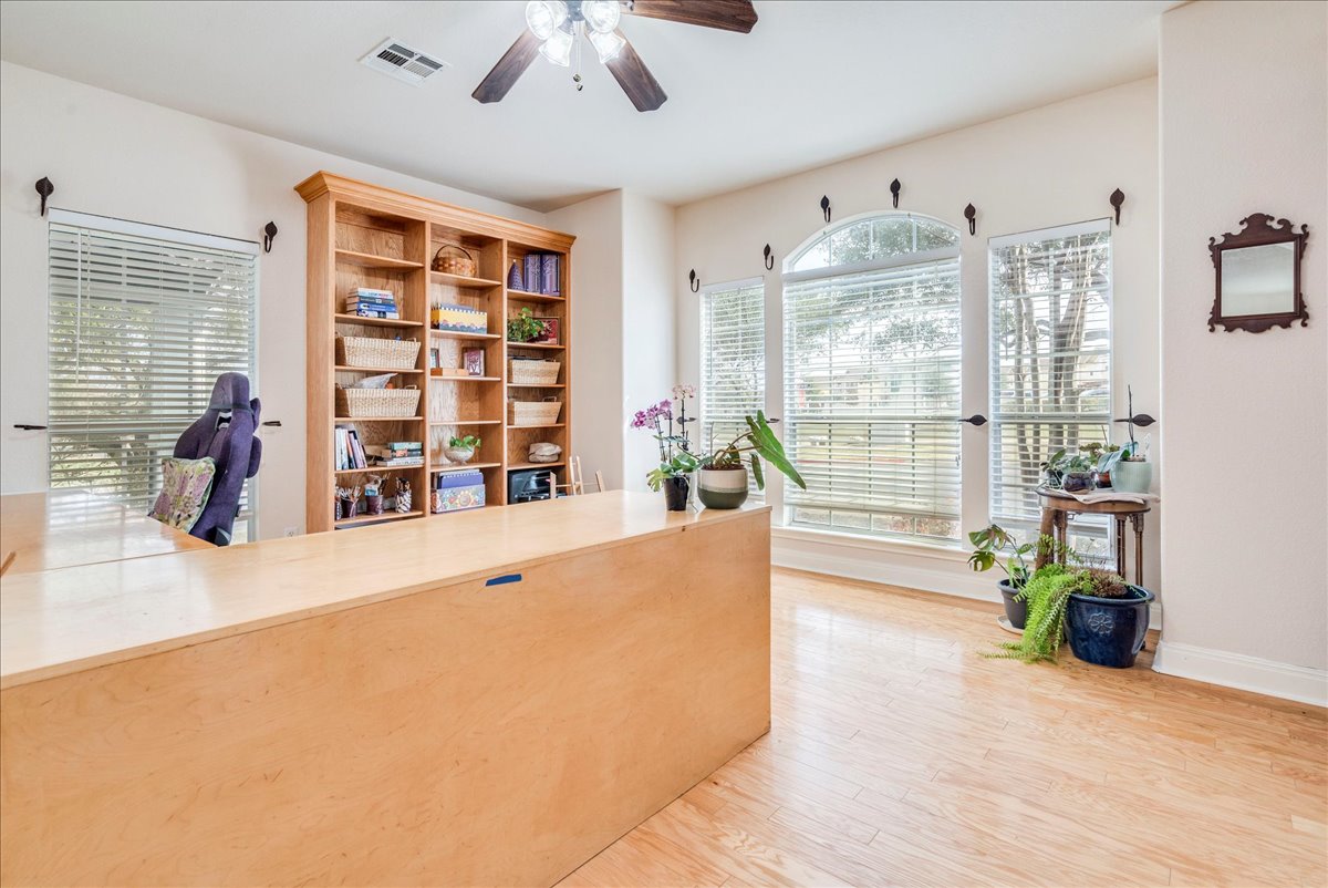 1077 Fairway Kyle, TX 78640 - Photo 9 of 40 a living room with furniture and large windows