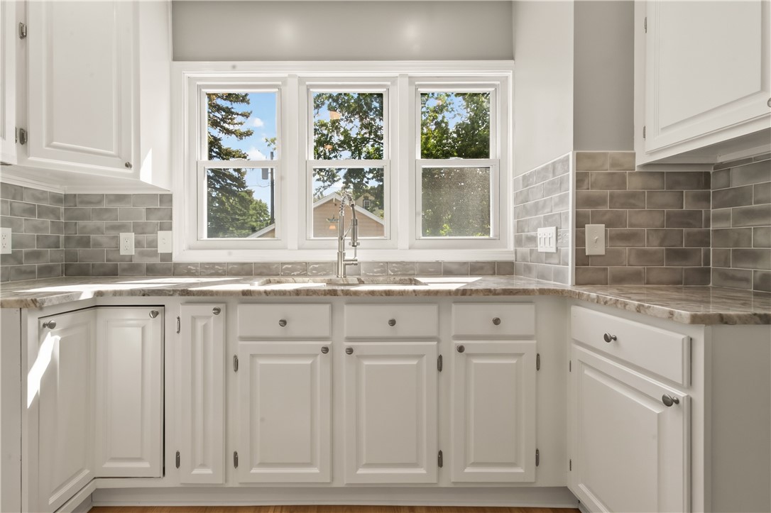 67 Harwick Road Irondequoit, NY 14609 - Photo 14 of 33 Gorgeous natural lighting creates a beautiful workspace while in the kitchen