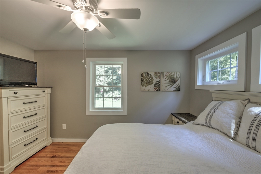 428 Bridge Road Northampton, MA 01062 - Photo 17 of 42 a bedroom with a bed and a flat screen tv