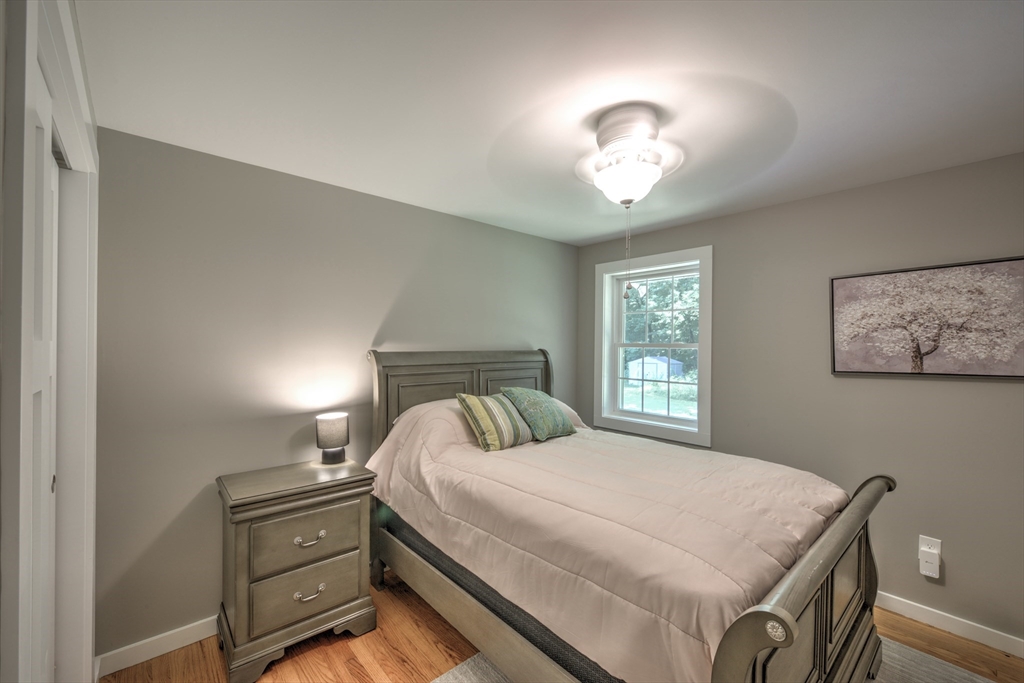 428 Bridge Road Northampton, MA 01062 - Photo 23 of 42 a bedroom with a bed and a window
