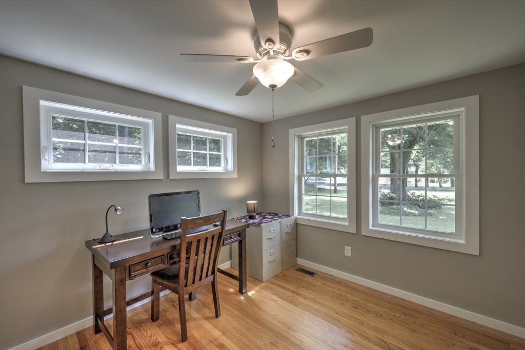 428 Bridge Road Northampton, MA 01062 - Photo 26 of 42 a workspace with wooden floor and windows