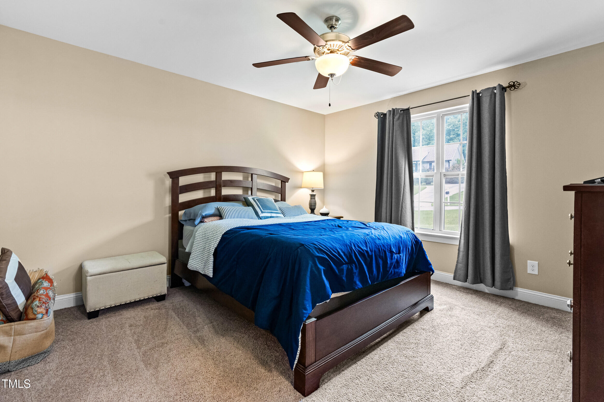 421 Angus Place Stem, NC 27581 - Photo 12 of 22 a spacious bedroom with a bed and window
