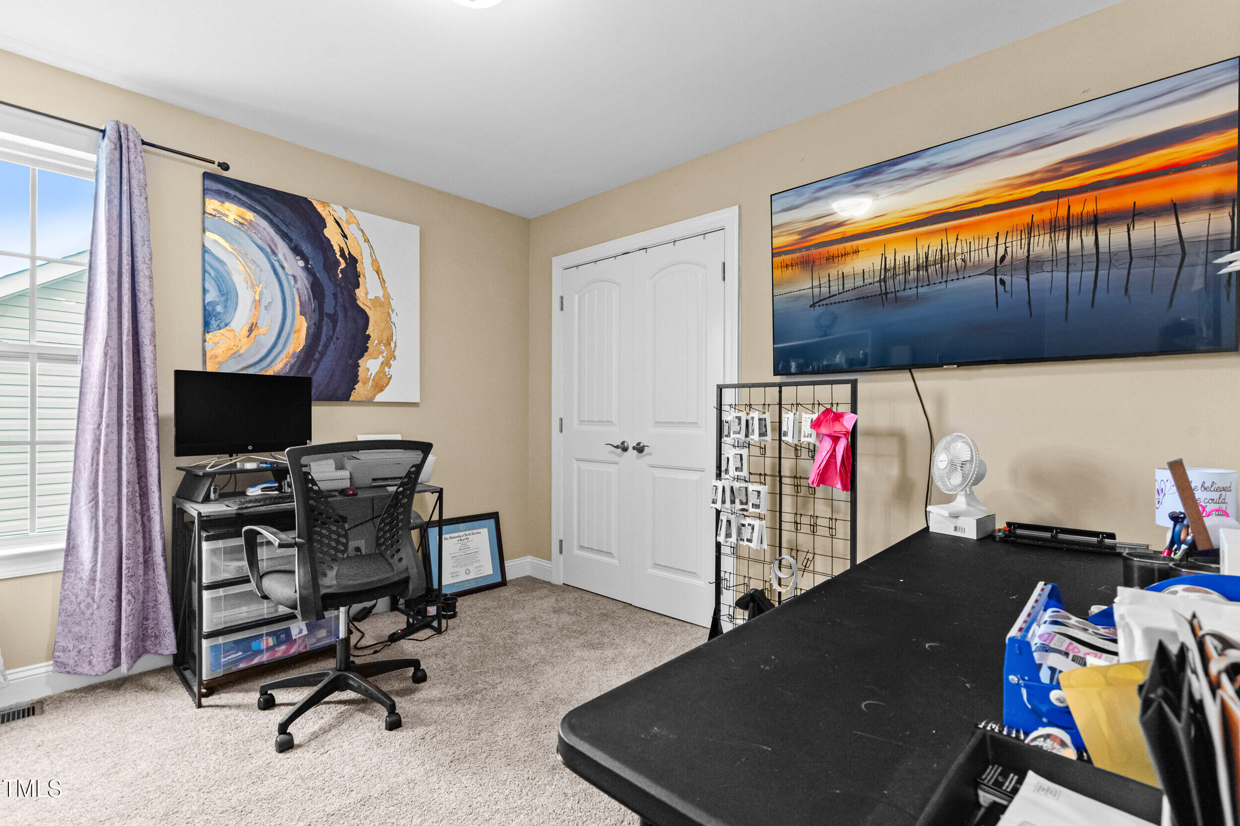 421 Angus Place Stem, NC 27581 - Photo 14 of 22 a view of a workspace with furniture and a window