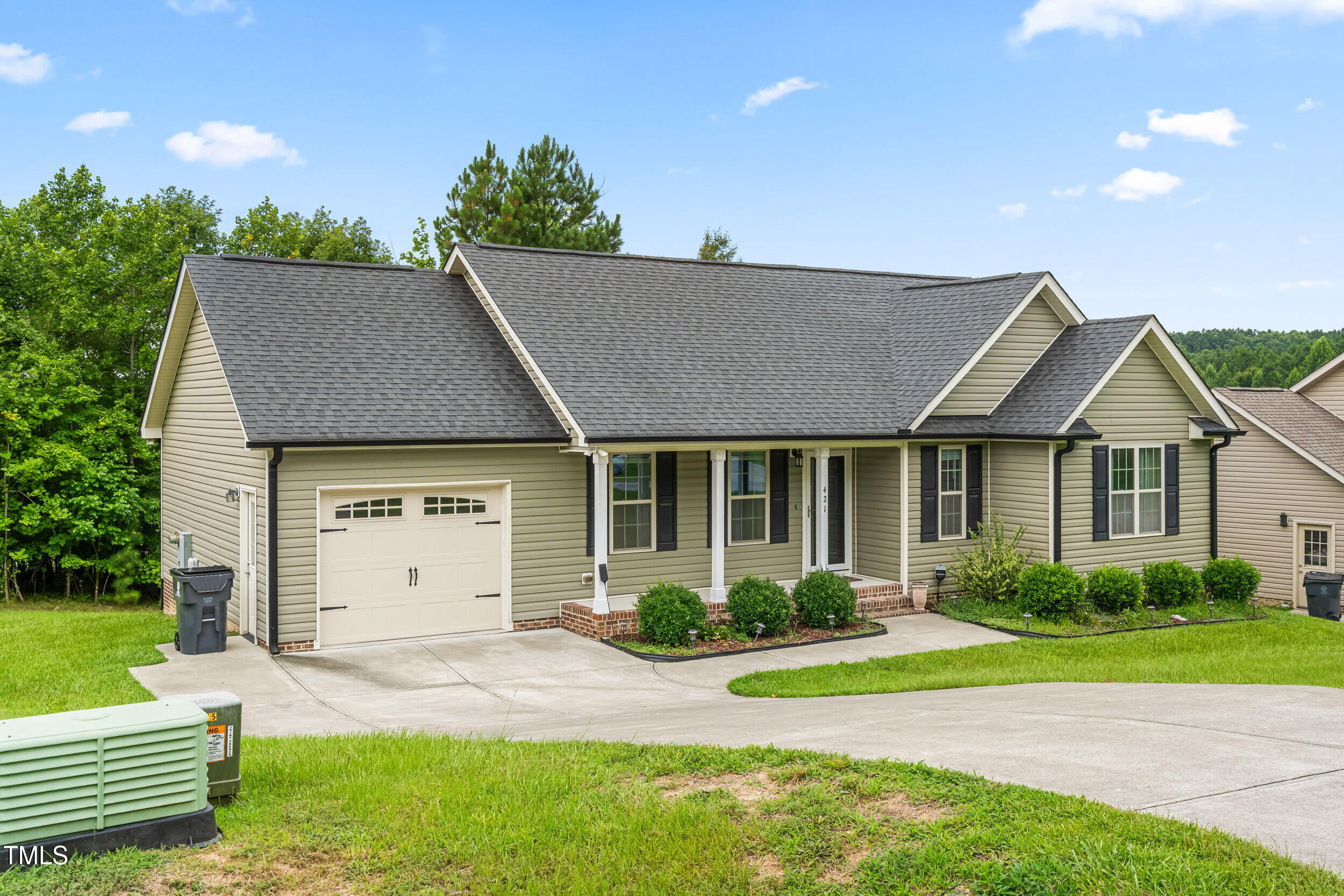 421 Angus Place Stem, NC 27581 - Photo 18 of 22 a view of a house with a yard