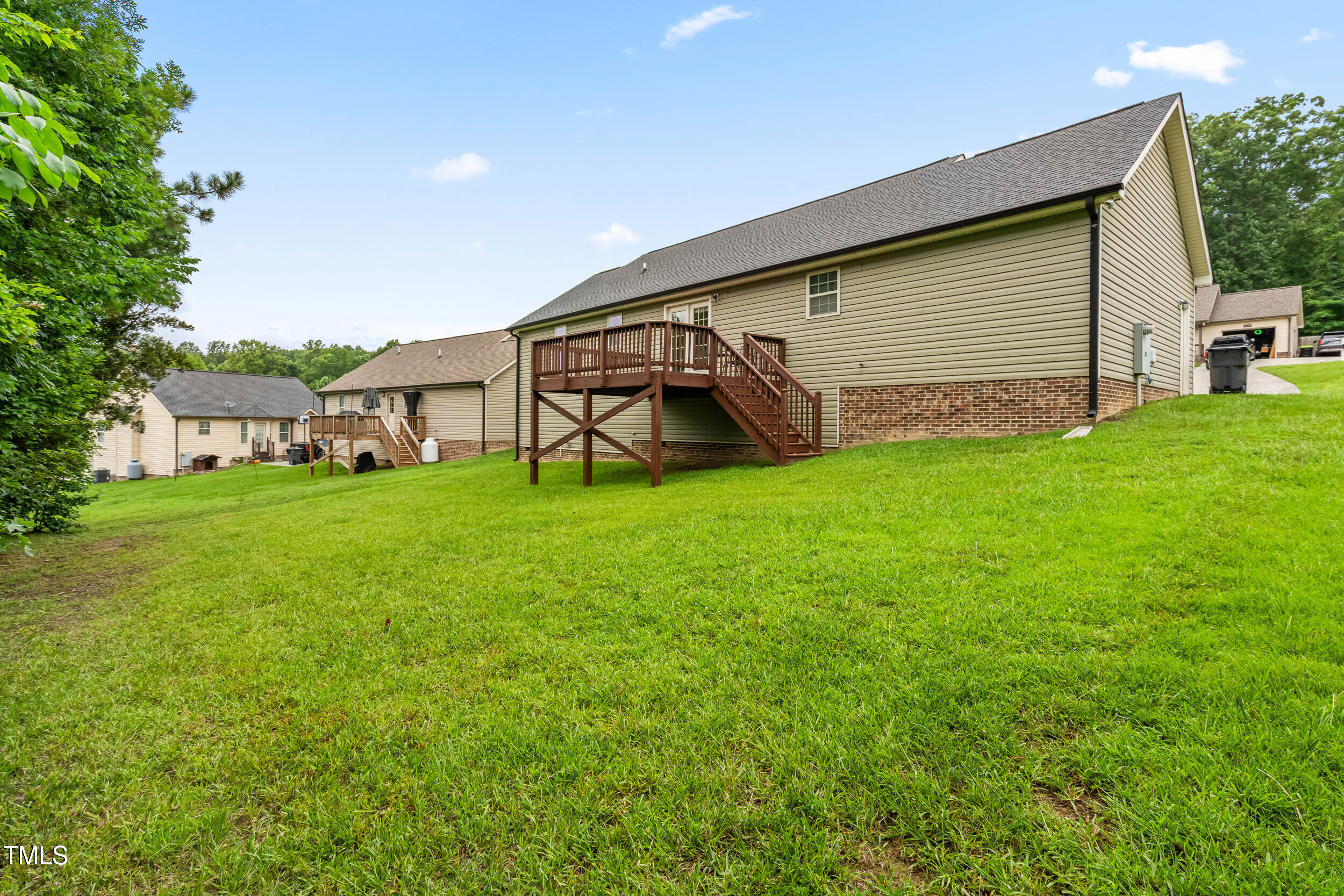 421 Angus Place Stem, NC 27581 - Photo 19 of 22 a view of a house with a yard and sitting area