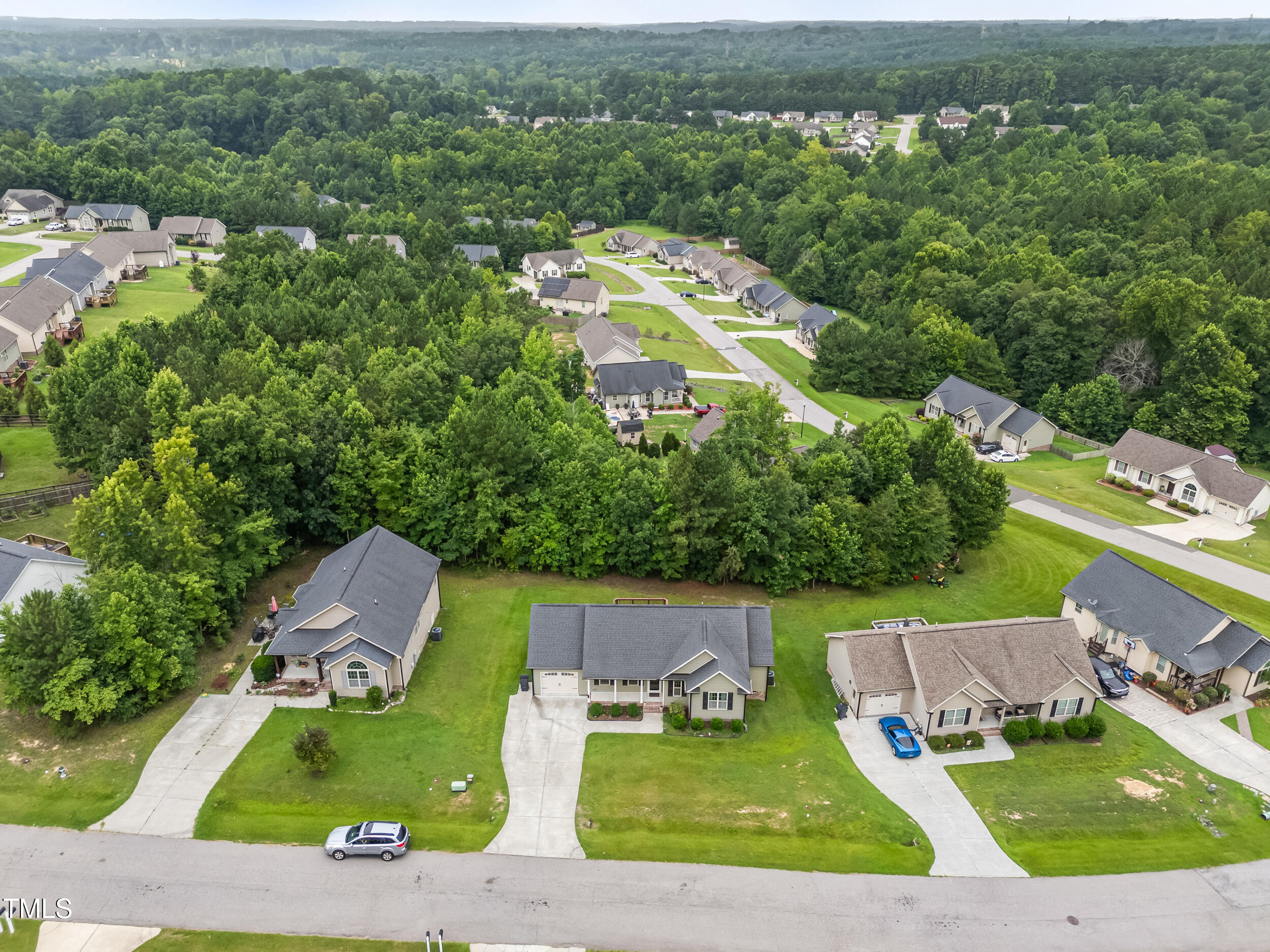 421 Angus Place Stem, NC 27581 - Photo 20 of 22 an aerial view of a house with a garden