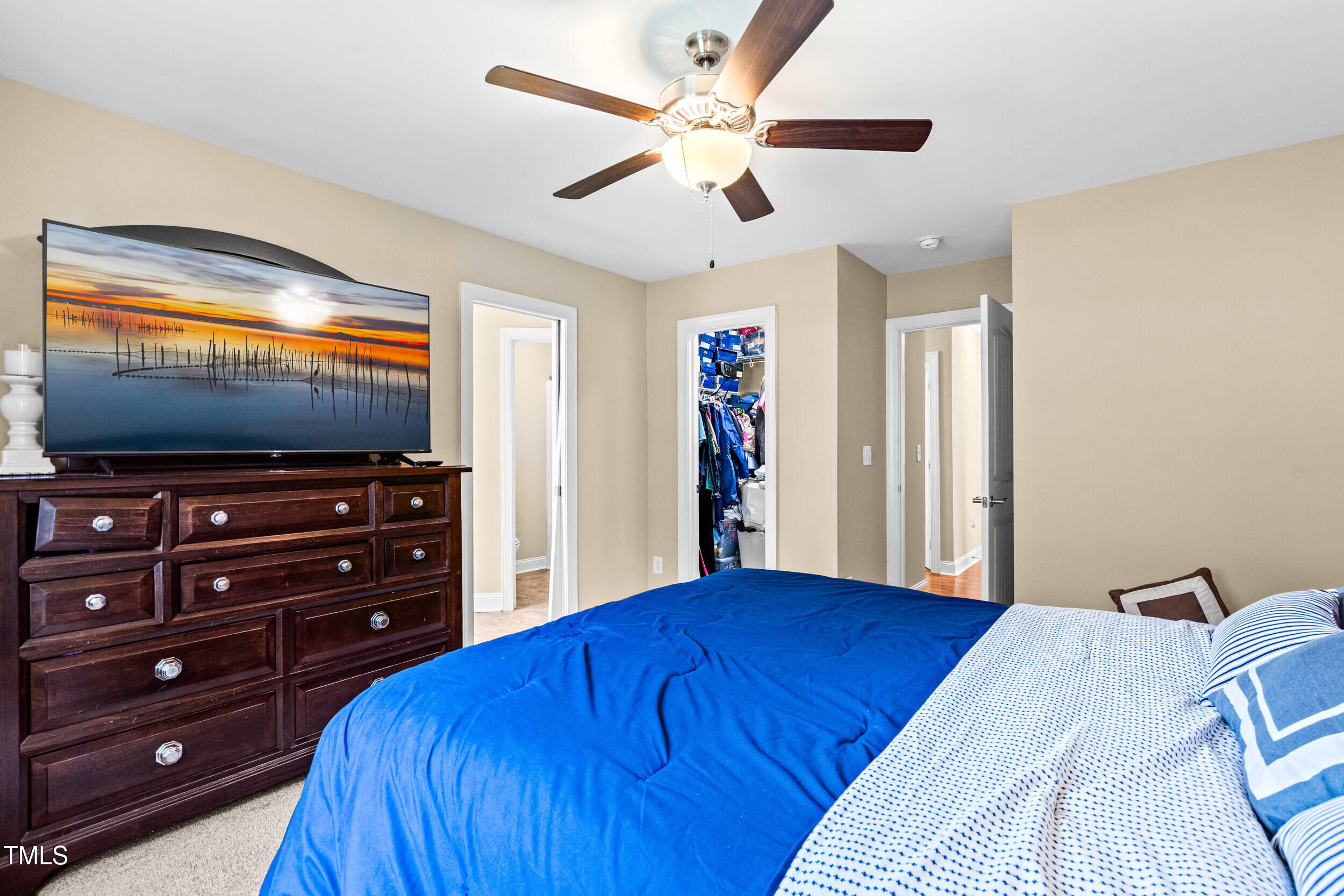 421 Angus Place Stem, NC 27581 - Photo 4 of 22 a bedroom with a bed and a flat screen tv