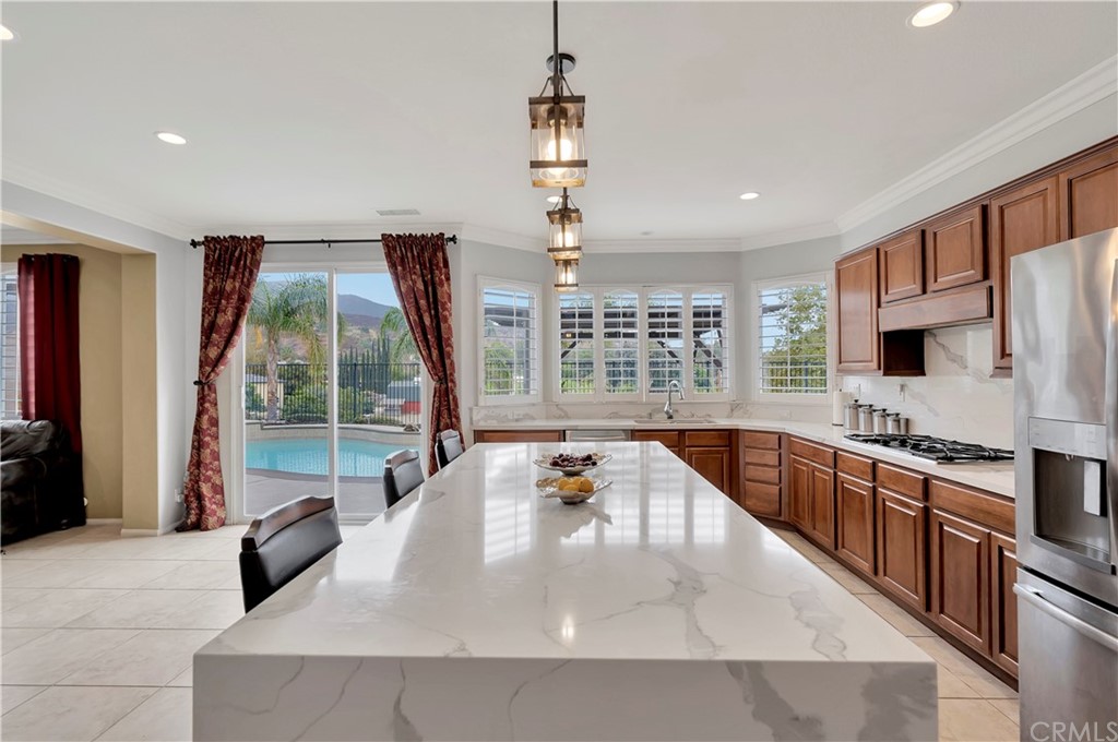 3426 Amethyst Street Corona, CA 92882 - Photo 20 of 72 a living room with furniture a flat screen tv and a couch