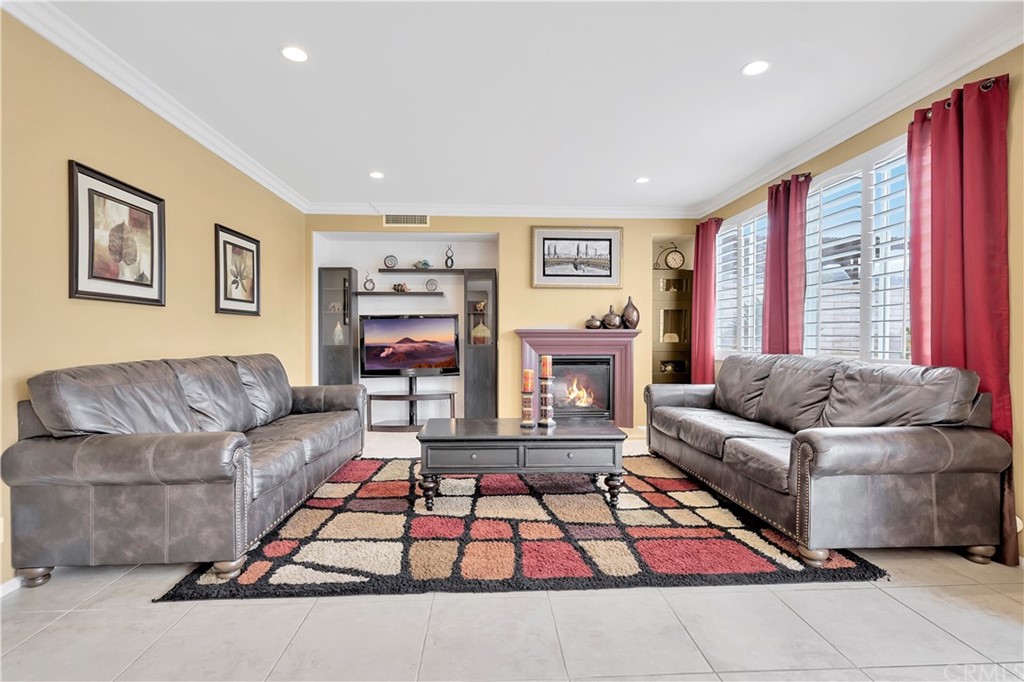 3426 Amethyst Street Corona, CA 92882 - Photo 21 of 72 a living room with furniture and a large window
