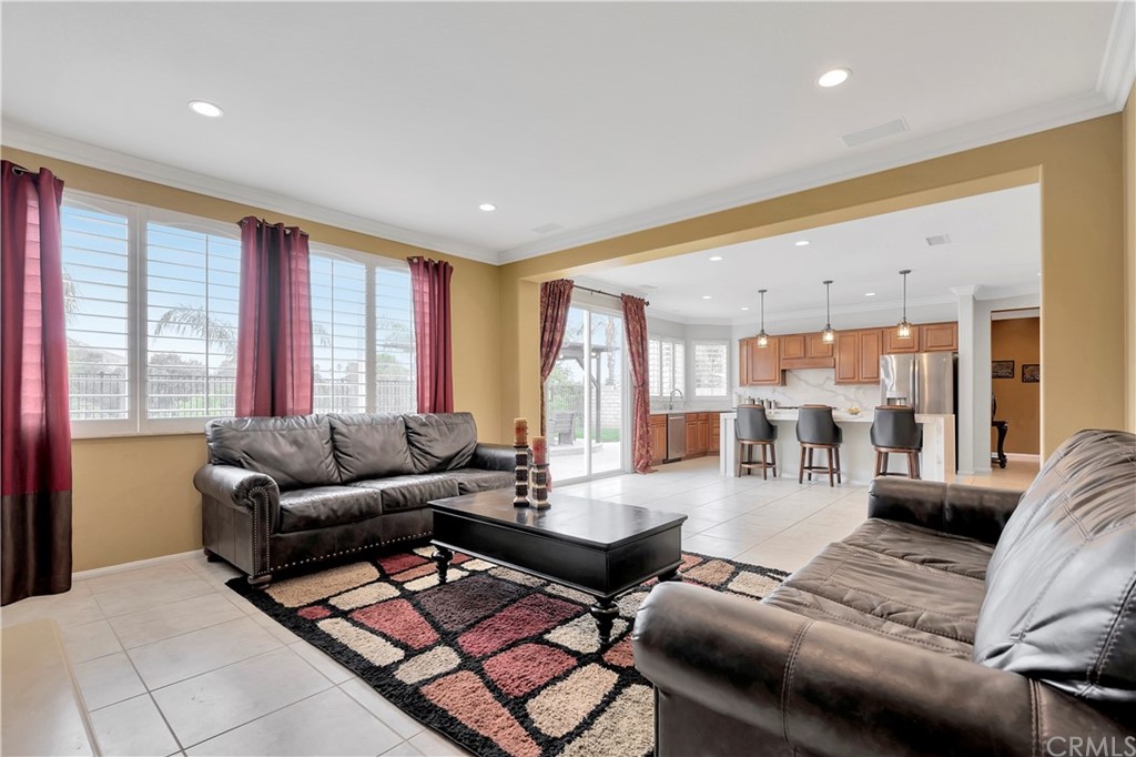 3426 Amethyst Street Corona, CA 92882 - Photo 22 of 72 a living room with furniture and a table