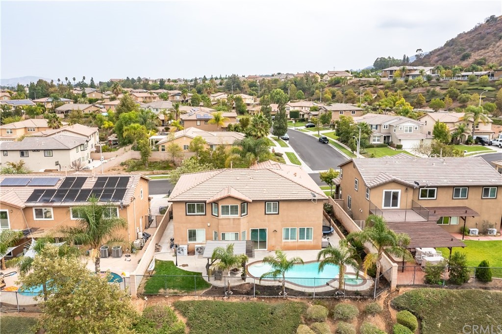 3426 Amethyst Street Corona, CA 92882 - Photo 25 of 72 a view of a house with pool and sitting area