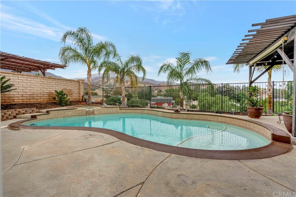 3426 Amethyst Street Corona, CA 92882 - Photo 28 of 72 a view of a patio with a table chairs and a small yard