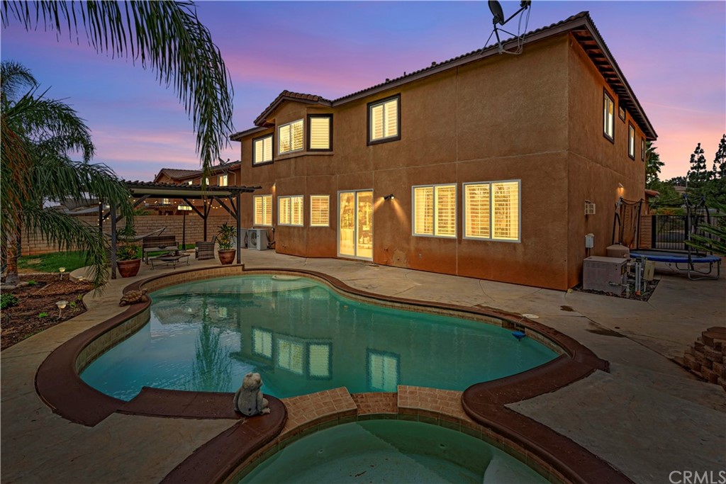 3426 Amethyst Street Corona, CA 92882 - Photo 29 of 72 a view of swimming pool with outdoor seating and a yard
