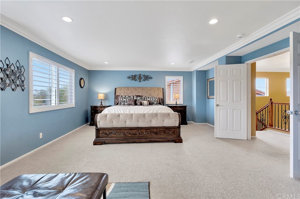 3426 Amethyst Street Corona, CA 92882 - Photo 34 of 72 a spacious bedroom with a bed and a window