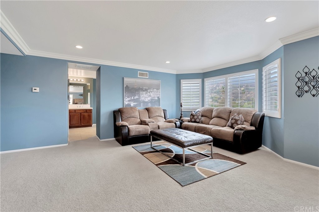 3426 Amethyst Street Corona, CA 92882 - Photo 35 of 72 a living room with furniture and a large window