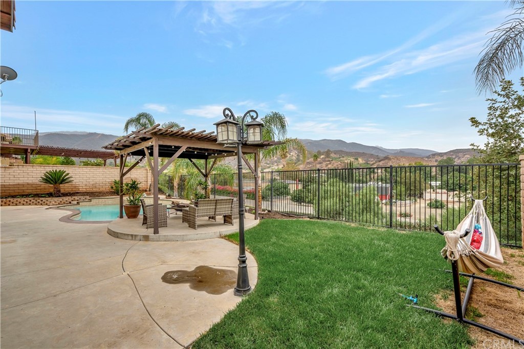 3426 Amethyst Street Corona, CA 92882 - Photo 5 of 72 a view of a swimming pool with a lounge chair
