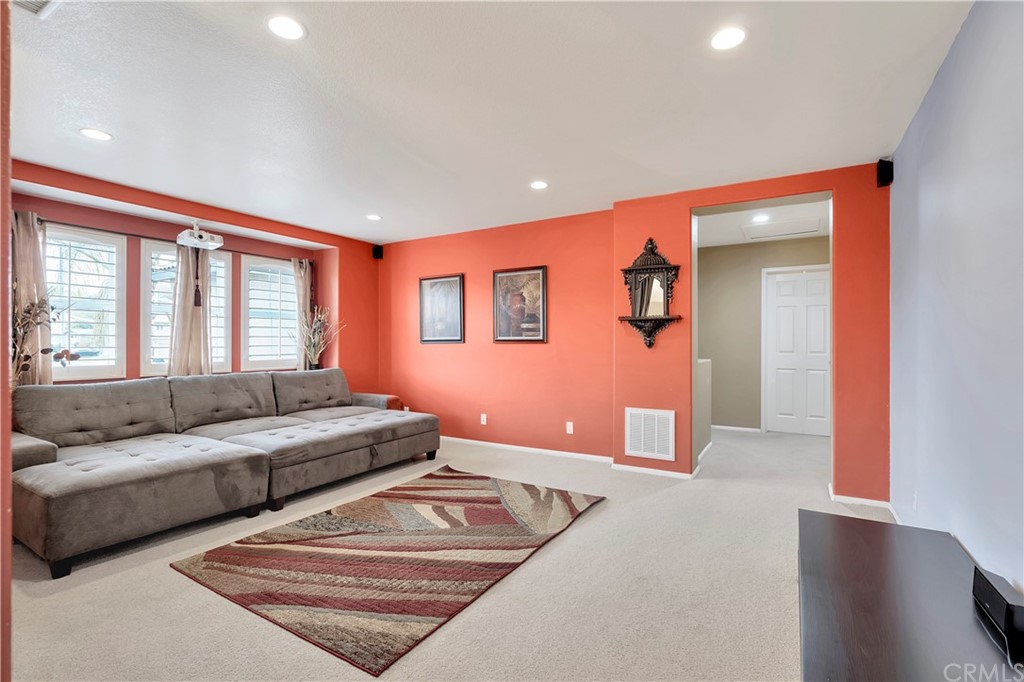 3426 Amethyst Street Corona, CA 92882 - Photo 43 of 72 a living room with furniture and a large window