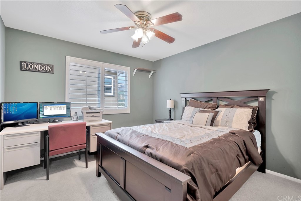 3426 Amethyst Street Corona, CA 92882 - Photo 50 of 72 a bedroom with a bed and a chandelier