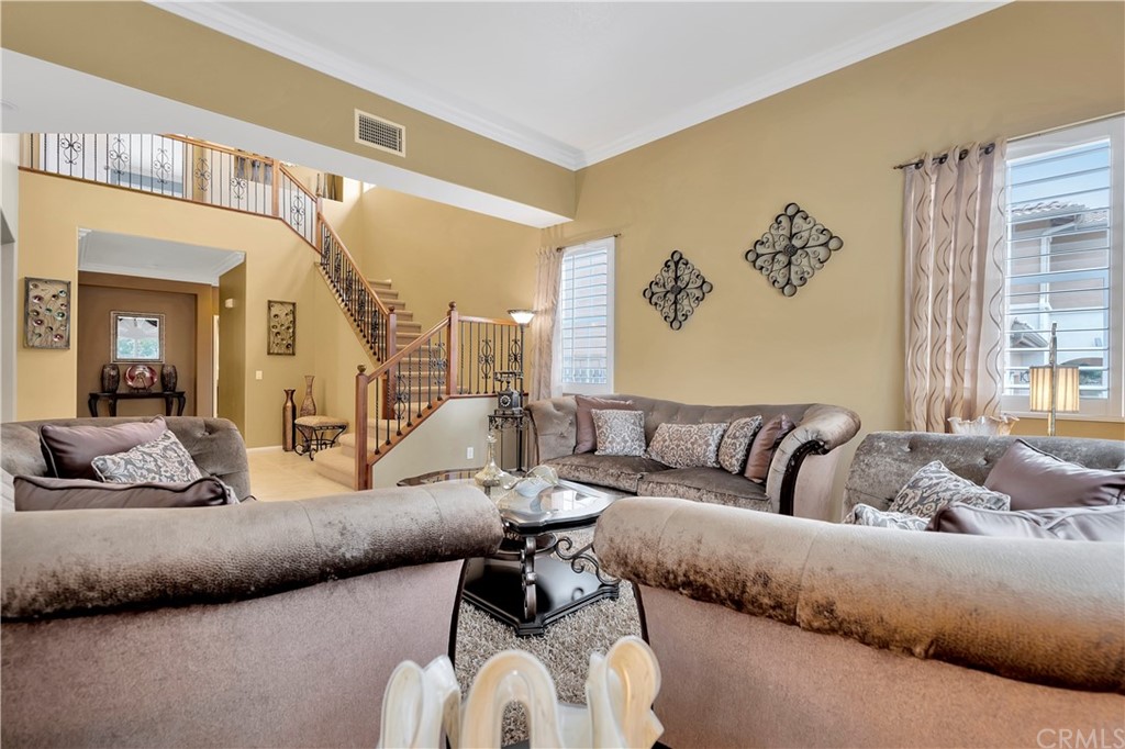 3426 Amethyst Street Corona, CA 92882 - Photo 51 of 72 a living room with furniture and a large window