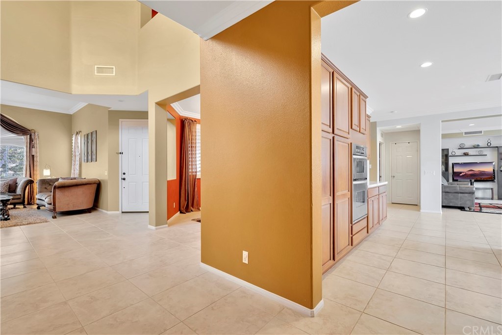 3426 Amethyst Street Corona, CA 92882 - Photo 56 of 72 a view of a livingroom with furniture and a hallway