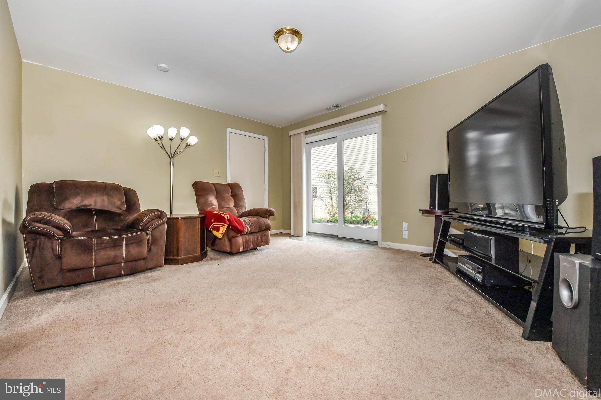 10794 Forest Edge Circle New Market, MD 21774 - Photo 17 of 41 Basement rec room with walk out to flat yard