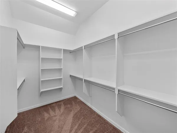 an empty room with a fan