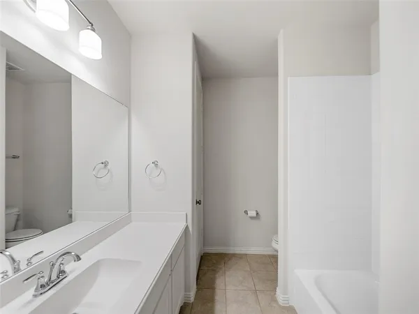 a view of an empty room and a window