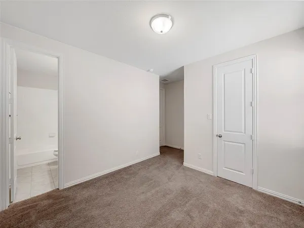 an aerial view of a house with garden space and street view