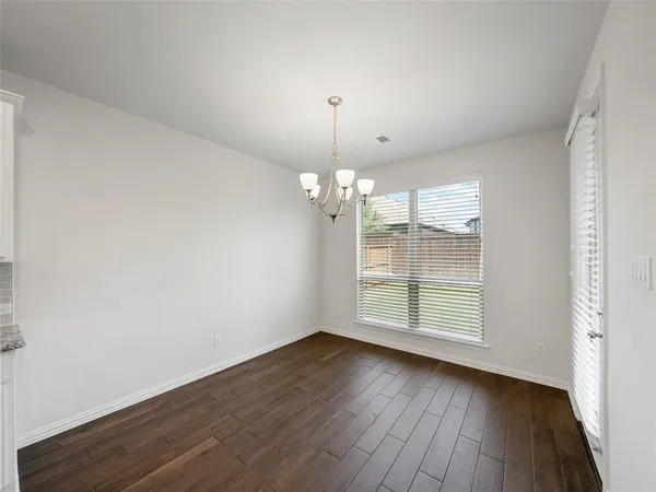 a view of kitchen with sink and wooden floor