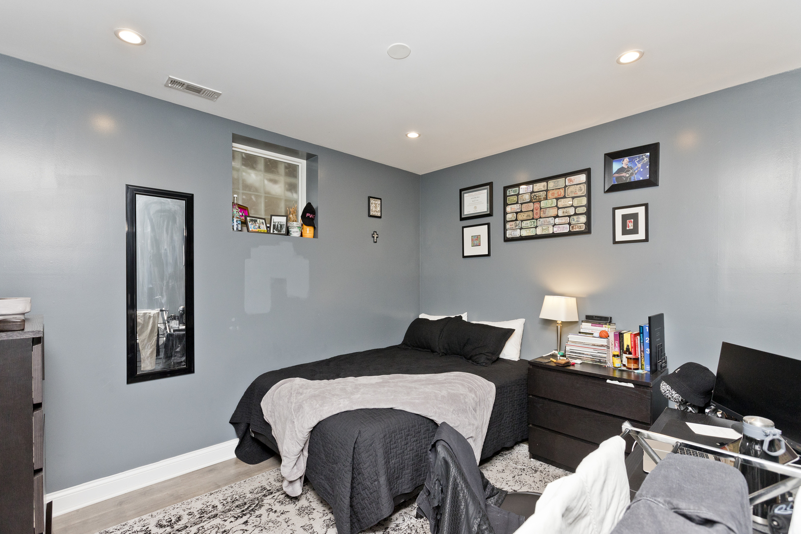 Undisclosed Address Chicago, IL 60614 - Photo 15 of 21 a bedroom with a bed and a computer on a table