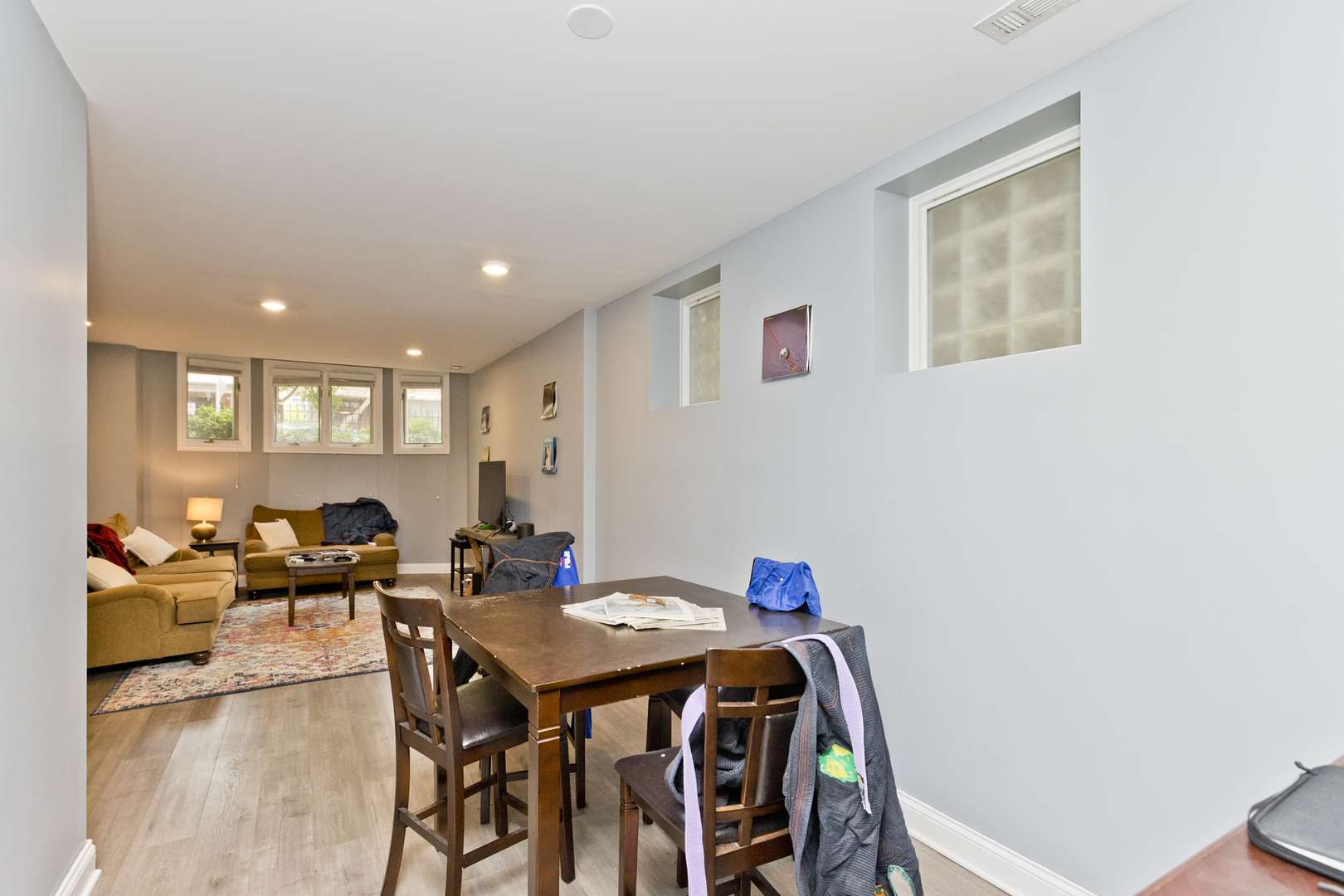 Undisclosed Address Chicago, IL 60614 - Photo 19 of 21 a view of a dining room with furniture and wooden floor