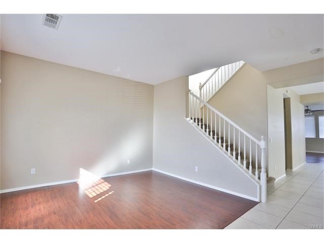36 Cold Spring Avenue Beaumont, CA 92223 - Photo 3 of 18 a view of an empty room with wooden floor