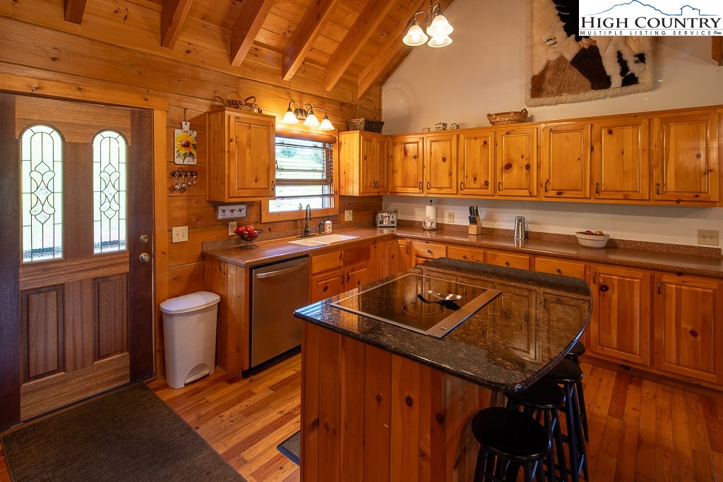 2191 Sorrento Drive Boone, NC 28607 - Photo 11 of 48 a kitchen with a sink a counter and chairs
