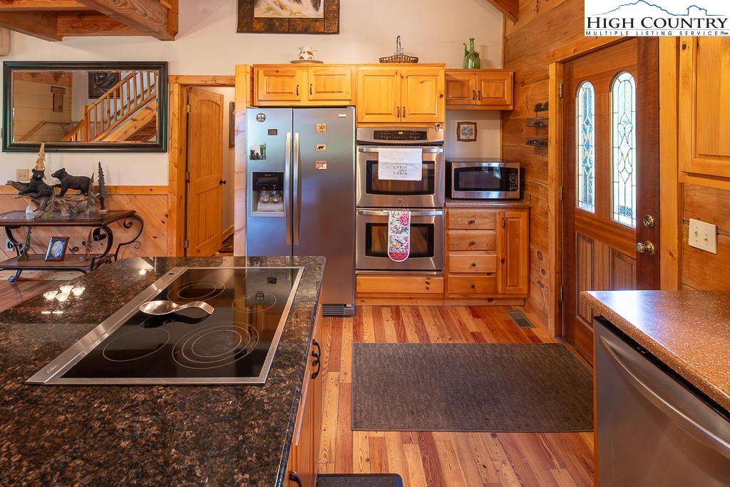 2191 Sorrento Drive Boone, NC 28607 - Photo 13 of 48 a kitchen with stainless steel appliances granite countertop a refrigerator and a stove