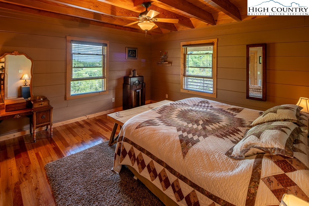 2191 Sorrento Drive Boone, NC 28607 - Photo 14 of 48 a bed sitting in a bedroom next to a window