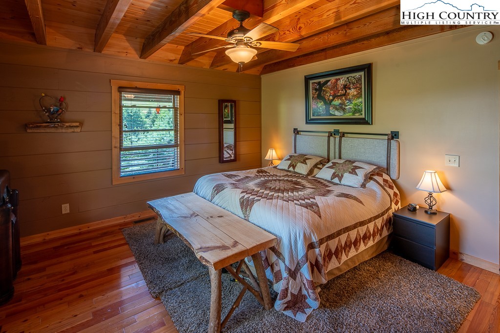 2191 Sorrento Drive Boone, NC 28607 - Photo 15 of 48 a bed sitting in a bedroom next to a window