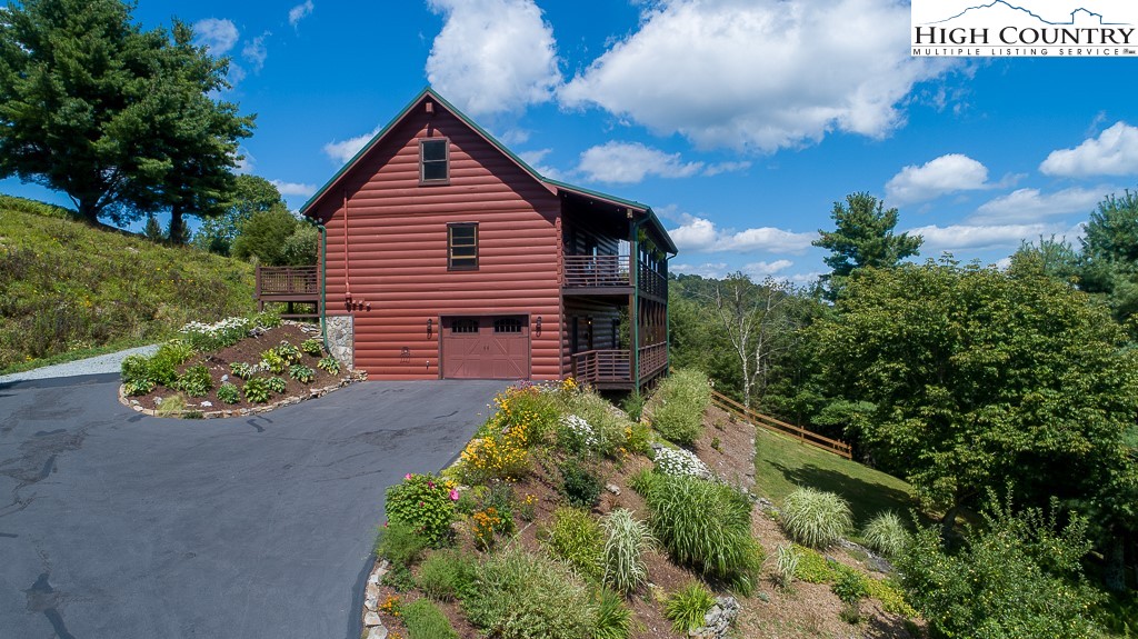 2191 Sorrento Drive Boone, NC 28607 - Photo 2 of 48 a front view of a house with a yard