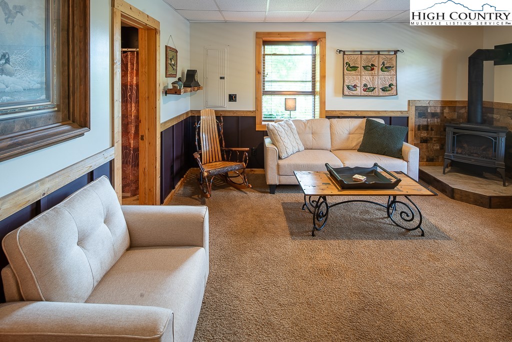 2191 Sorrento Drive Boone, NC 28607 - Photo 29 of 48 a living room with furniture and a fireplace