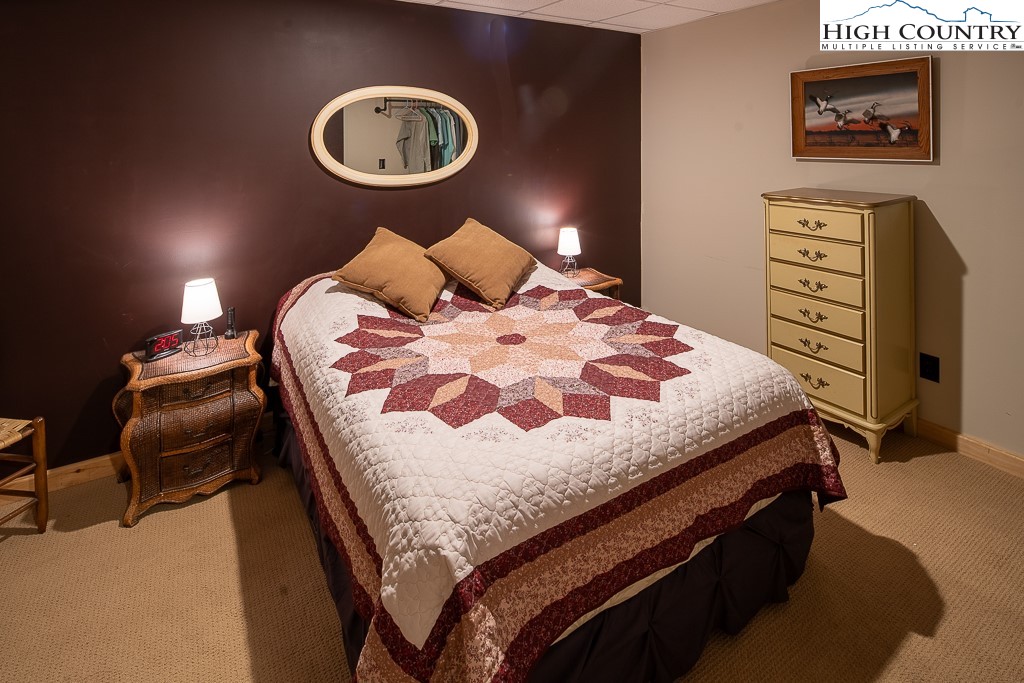 2191 Sorrento Drive Boone, NC 28607 - Photo 33 of 48 a bedroom with a bed and dresser