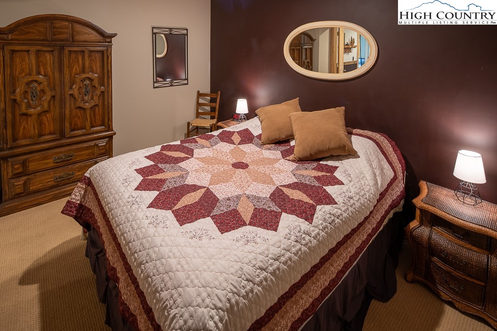 2191 Sorrento Drive Boone, NC 28607 - Photo 34 of 48 a bedroom with a bed and painting on the wall