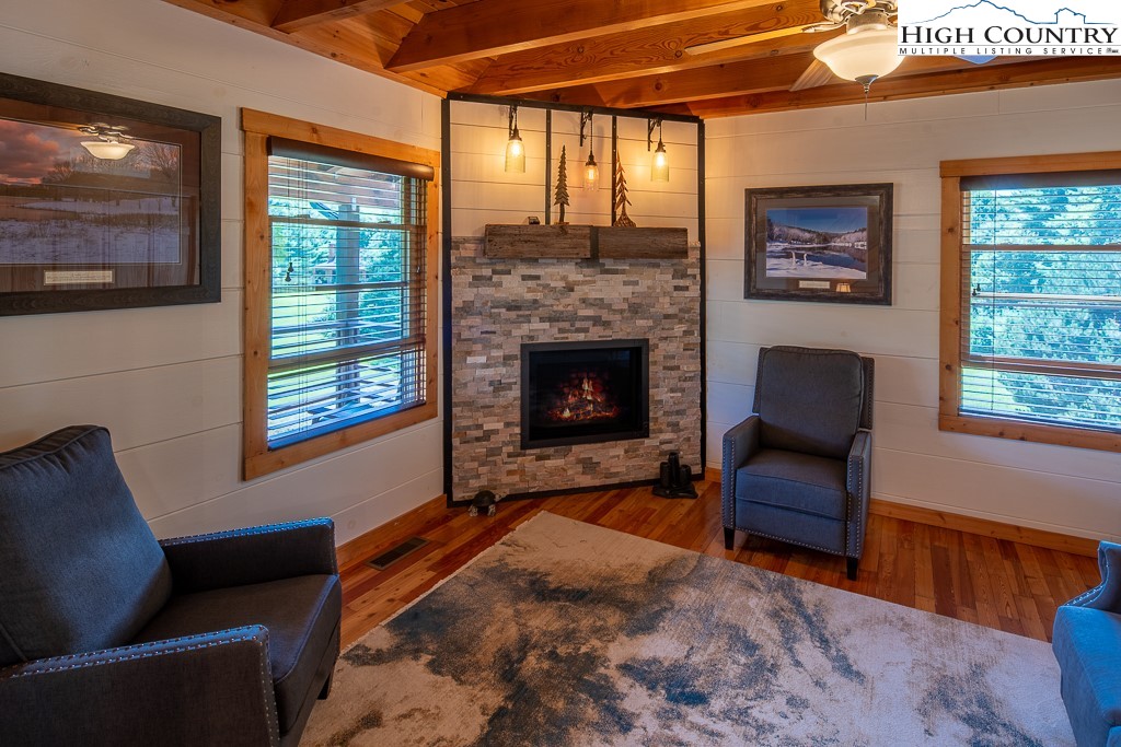 2191 Sorrento Drive Boone, NC 28607 - Photo 7 of 48 a living room with furniture and a fireplace