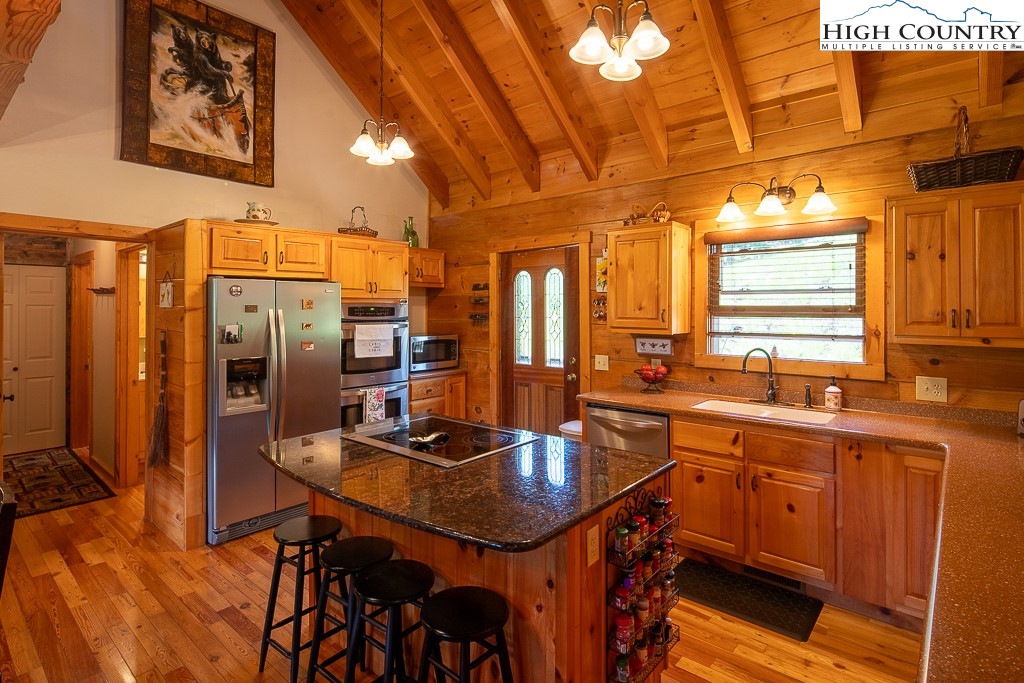 2191 Sorrento Drive Boone, NC 28607 - Photo 10 of 48 a kitchen with stainless steel appliances a sink stove and refrigerator