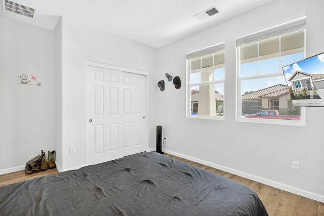 a bedroom with a bed and a window