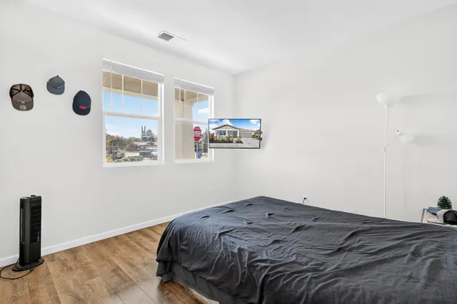 a bedroom with a bed and a window