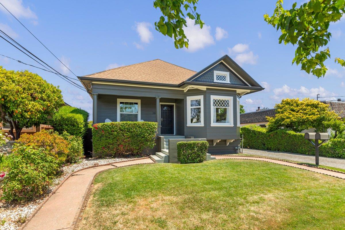 a front view of a house with a yard