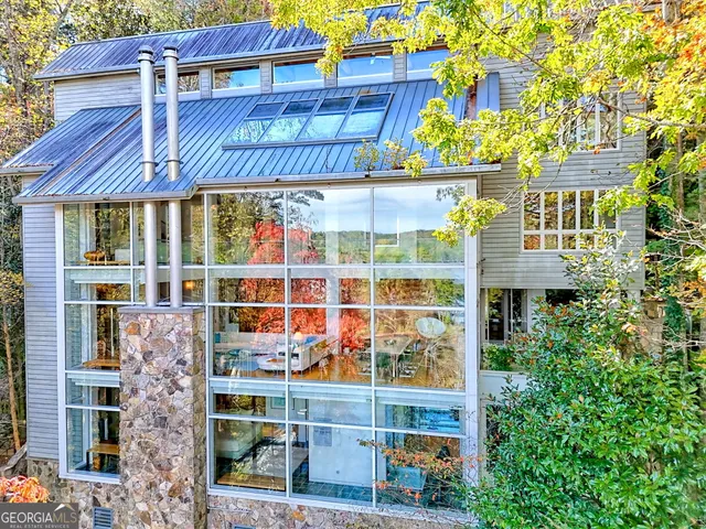 a view of a lake with houses in the back